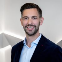 Bernd Eder, smiling in formal attire, as a new member of the CANCOM Austria Executive Board.